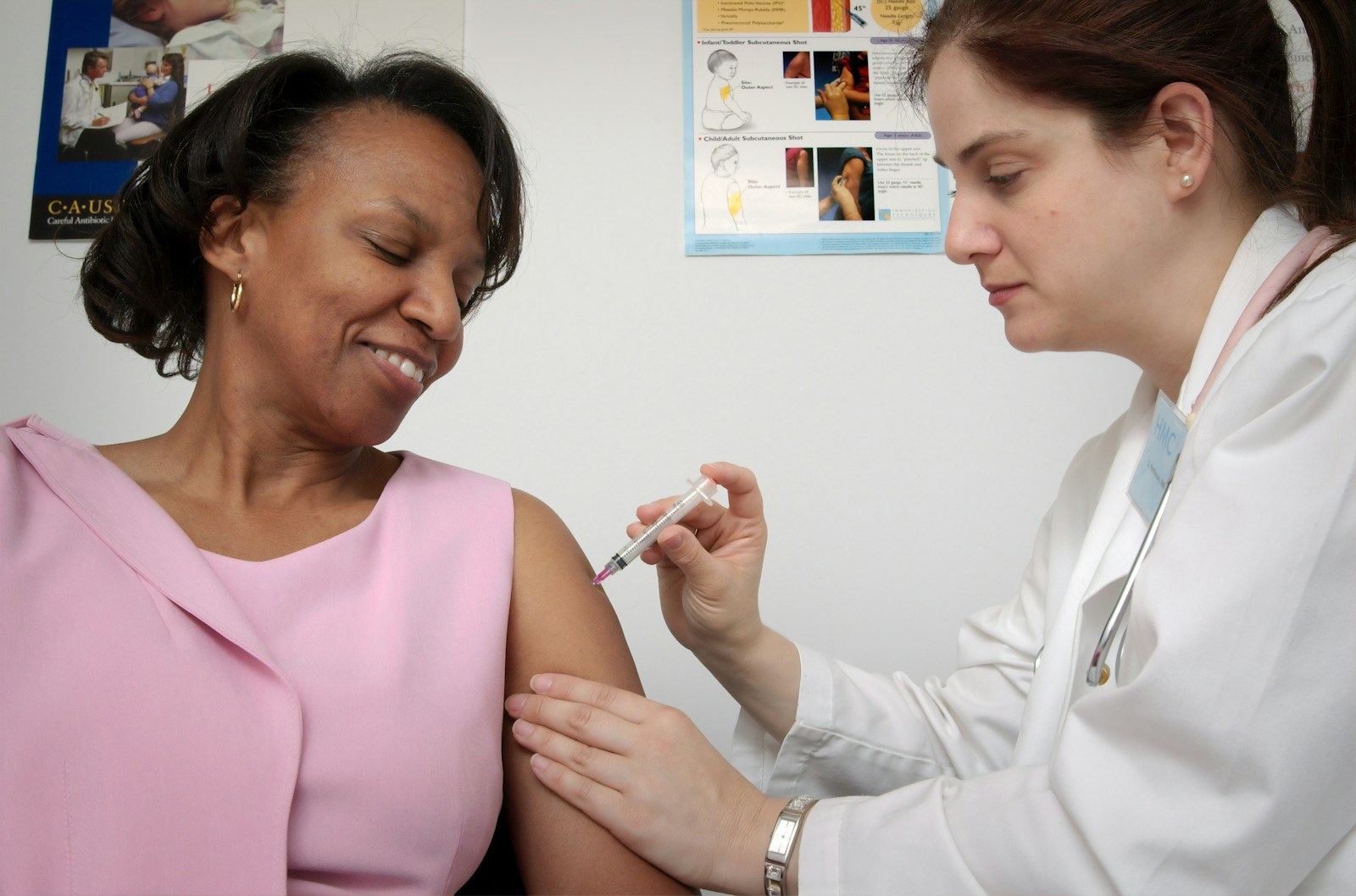 woman getting vaccine, health insurance